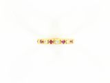 une bague en or jaune sertie de pierres roses et blanches