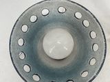 a blue and white bowl with holes on it