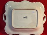 a white plate that has a picture of a man on it