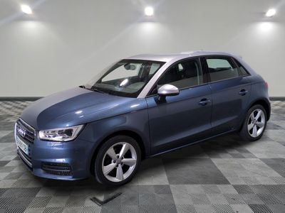 the blue car is parked in the garage on a checkered floor