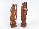 pair of carved wood figures of a woman and a man