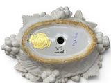 a white bowl with a gold leaf decoration on it