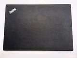 a black mouse pad on a white surface