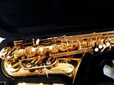 a saxophone that is in a case on a table