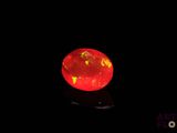 an orange fire oplite is lit up in the dark