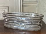 a glass bowl sitting on a wooden table