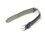 black leather watch strap with silver buckle on a white background