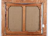 an old wooden frame with a picture hanging on a wall