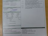 une photo d'un ticket de caisse posé sur une table en bois