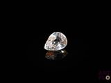 a close up of a diamond on a black surface
