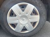 a close up of a car ' s tire on the street