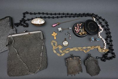 a lot of beads and a purse on a table