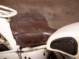 a close up of a motorcycle with a leather seat