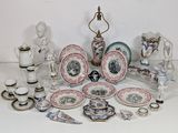 many different types of plates and vases on the table