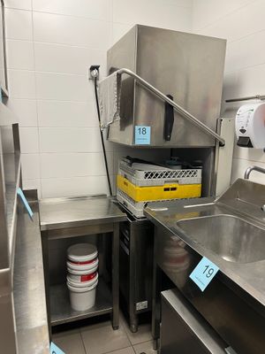 a kitchen with a sink and a refrigerator in it