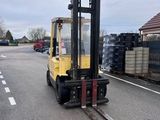 a fork lift truck parked in a parking lot