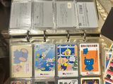 a suitcase full of cards that are sitting on a table