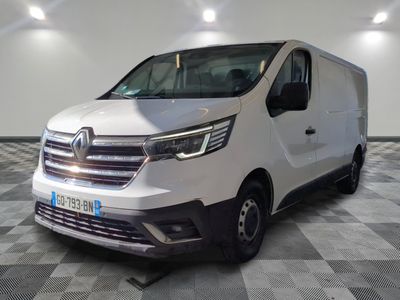 the white van is parked in a large room with checkered floor