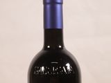 a bottle of wine that is sitting on a table