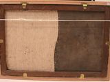 a picture of a piece of art in a wooden box