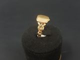 a gold ring on a black ring box