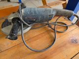 a sander that is sitting on a wooden table