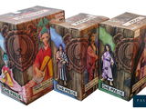 three boxes of one piece figurines on a white background