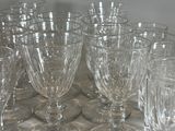 a lot of empty wine glasses sitting on a table
