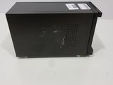 a close up of a small black box on a white surface