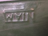 a close up of a metal box with a name on it
