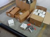 a pile of cardboard boxes and other items on the floor