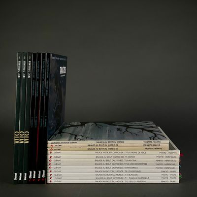 a stack of books sitting on top of each other on a table