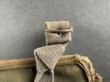 a tie that is tied to a bag on a table