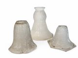 three glass vases sitting next to each other on a white surface