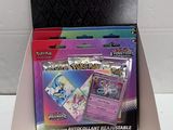 a box of pokemon trading cards in a display case