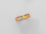 a yellow gold ring with multi colored stones