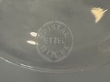 a close up of a glass bowl with a logo on it