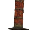 a large knife that is on top of a pole