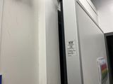 a white door with a sign on it in a room