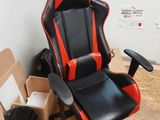 a black and red office chair in a room