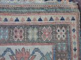 an image of a close up of a rug on a wooden floor