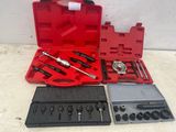 a red case with tools in it on a table