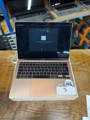 a laptop that is sitting on a table in front of other laptops