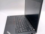 a laptop with a black keyboard sitting on a table