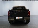 a black pickup truck parked in a white room
