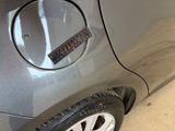 a close up of a car door with a sticker on it