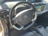 the interior of a car with a steering wheel and dashboard controls