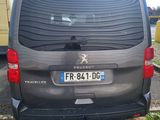 a small black van parked in a parking lot