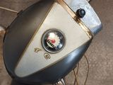 a close up of a motorcycle with a badge on it