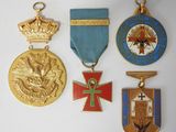 several medals and medals are displayed on a white surface